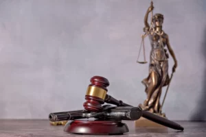 Illustration of a gun, gavel, and scale of justice highlighting the role of a weapon lawyer