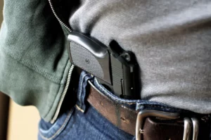 A snapshot of a gun tucked behind a belt, representing Florida's Stand Your Ground law